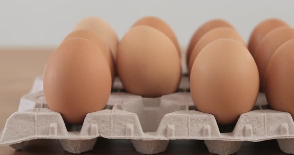 Hand taking out eggs in the package 