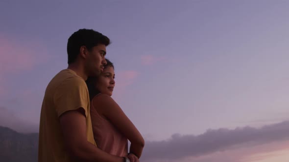 Young couple enjoying the sunset view