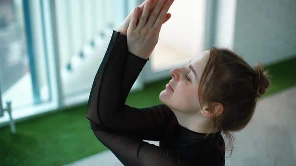 Portrait of Young Yogini Woman Meditate with Hands in Namaste Mudra