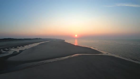 A spring day at the beach. Aerial by the ocean at the sunset