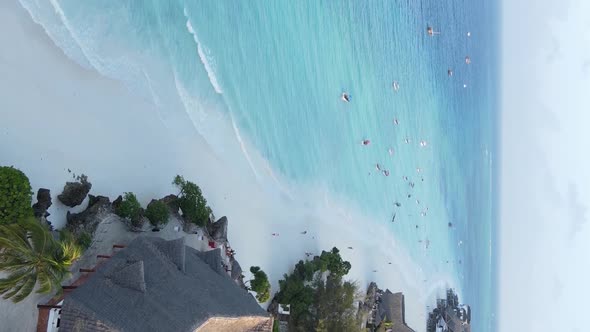 Vertical Video Boats in the Ocean Near the Coast of Zanzibar Tanzania Aerial View