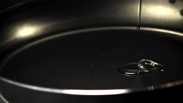 A Super Slow Motion Jet of Oil Pours Into the Pan