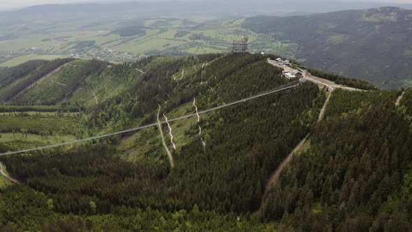 Fast drone shot of world's longest suspension bridge in czech Moravia.