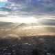 Landscape view of the city of rural village in valley on foggy day while the sun is raising by drone - VideoHive Item for Sale