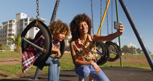 Mother and son having fun at playground