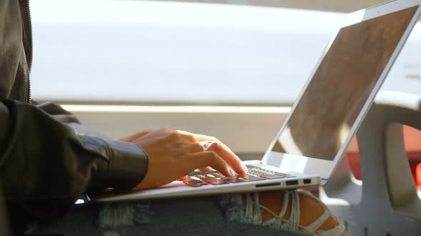 Teenage girl using laptop