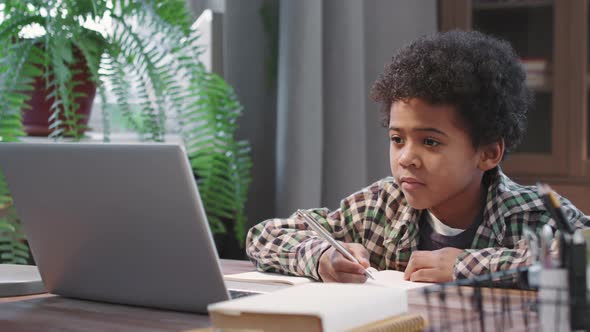 Cute Afro Kid Studying From Home