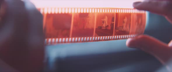 Close up of a film strip, showing a portrait of a man