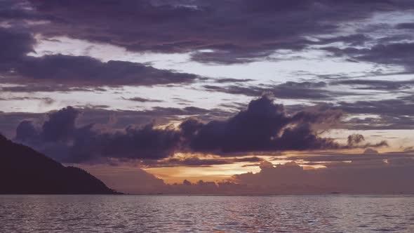 Monsuar and Ocean After Sunset. Blue Hour. Calm Waves Glistening on the Ocean Surface, West Papua