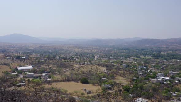 High angle shot of plants and hills on a sunny day in Mixteca Poblana, Puebla, Mexico