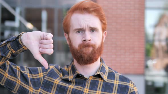 Thumbs Down by Redhead Beard Young Man, Outdoor