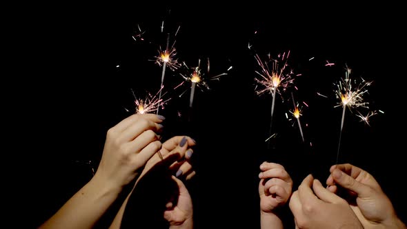 Closeup Hands Holding Waving Bengal Fire Burning Sparklers Front Black Background