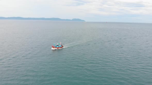 Professional Fishing Vessel Returns To the Port in the Morning in the Sunshine After Fishing