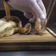 Chef Puts Roasted Scallops Near Grilled Ocean Perch Closeup - VideoHive Item for Sale