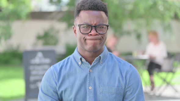 Portrait of Disappointed African Man Reacting Loss