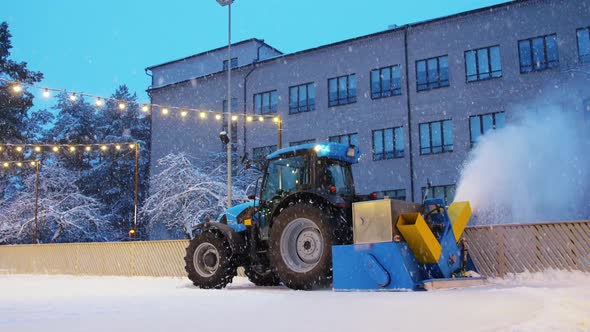 Tractor with Ice Resurfacer on Skating Rink