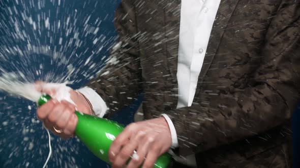 Male Hands Opening the Champagne Bottle