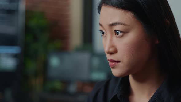 Closeup Portrait of Focused Asian Coder Writing Online Cloud Computing Code and Smiling Sitting at