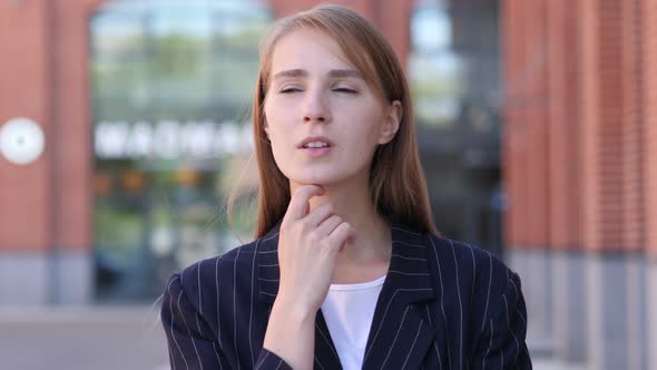 Portrait of Thinking Businesswoman Ouside Office