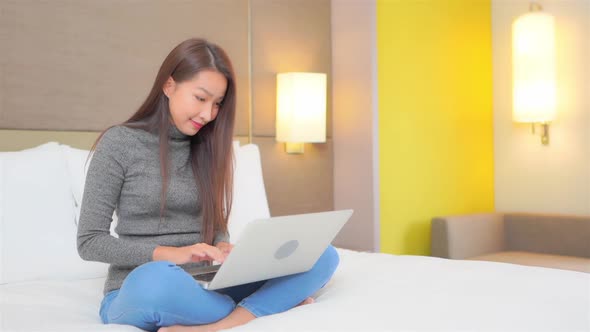 Young asian woman use laptop