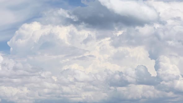 Time lapse of big fluffy clouds moving through the sky