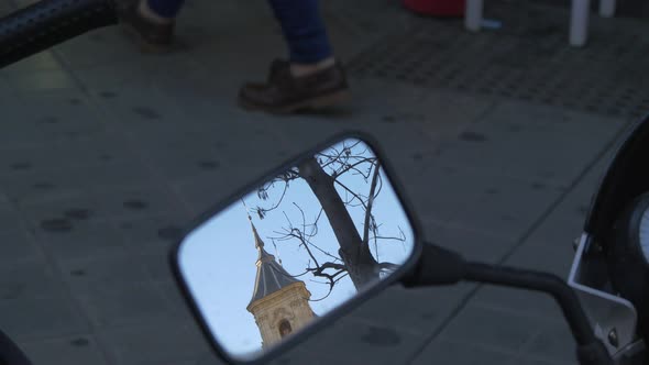 Tower seen in a motorcycle mirror