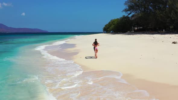 Romantic couple relax on luxury resort beach time by clear water with white sandy background of Gili