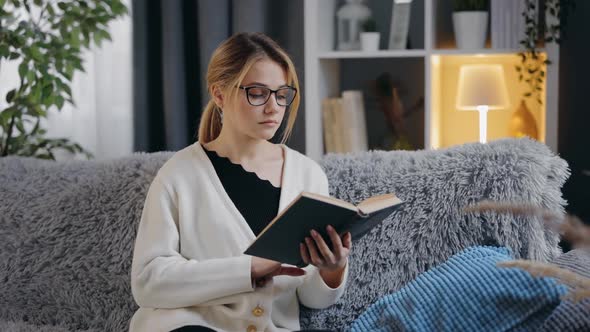 Pleasant Woman Reading Book Couch