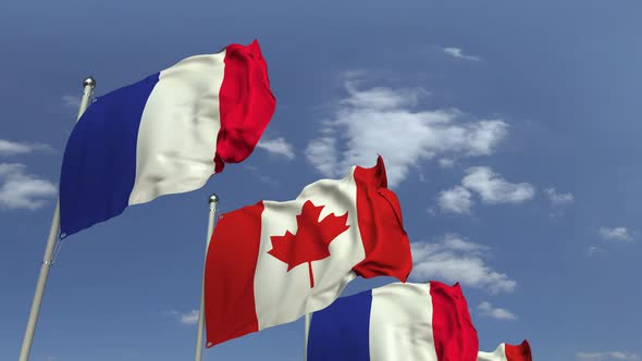 Row of Waving Flags of Canada and France