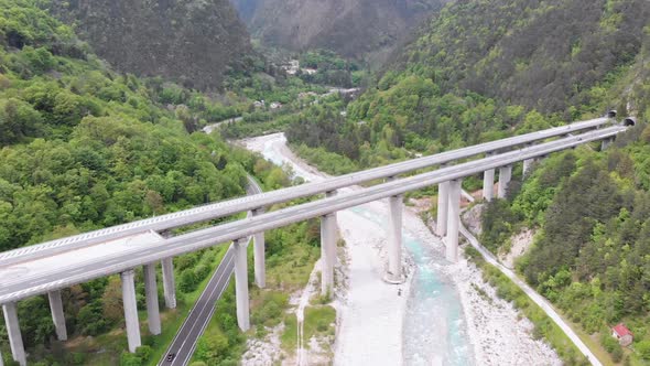 Aerial View of the Concrete Highway Viaduct on Concrete Pillars in the Mountains