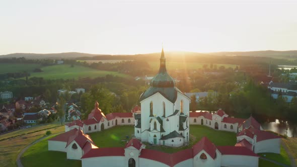 Flying Above the Pilgrimage Church of Saint John of Nepomuk on the Green Hill at Sunset