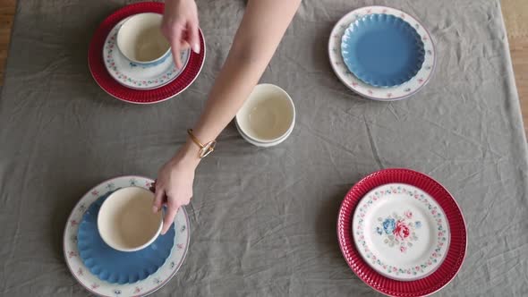 Christmas Table Decoration. Festive Table Setting. Female Hands Decorate the Table for Christmas