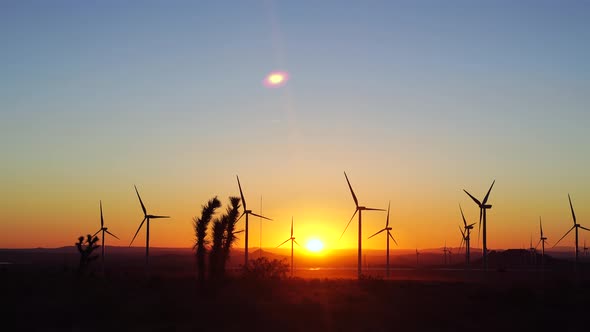 Sunrising through windmills in the mojave desert