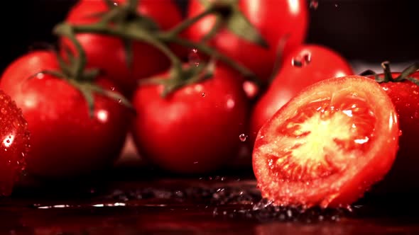 Super Slow Motion on a Piece of Tomato Fall Drops of Water