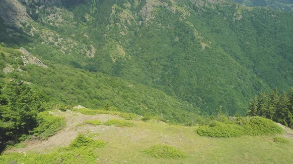 Hiker Taking Photos of Beautiful Deep Green Valley at Balkan Mountains Above Sopot