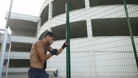 Fight with Shadow Boxer Doing Workout Outdoors