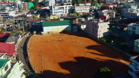 Children play soccer in school yard in Shillong India