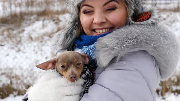 Girl Hugging her Dog, Winter Time