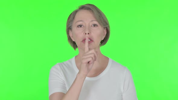 Old Woman with Finger on Lips Silence Green Screen