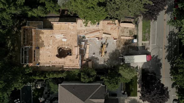 Aerial Top View of Workers Building New Residential Home