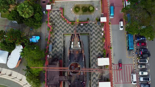 Aerial top down shot of giant sailing boat from the asian war monument in Melaka city.