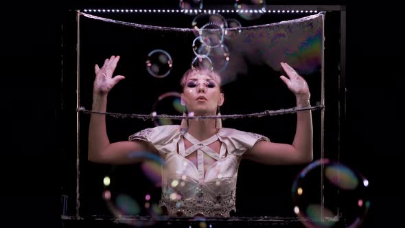 Model Girl Does Tricks with Soap Bubbles