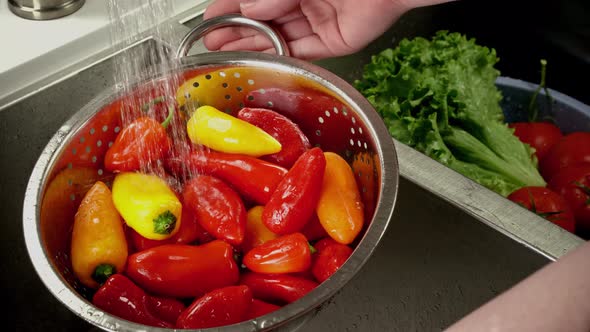 Close Up Of Peppers Being Washed