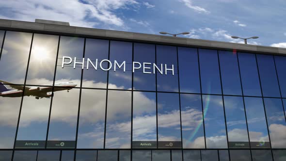 Airplane landing at Phnom Penh Cambodia airport mirrored in terminal