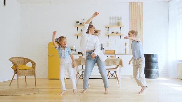 Happy Emotional Dance of Mother with Her Two Children Active Modern Family