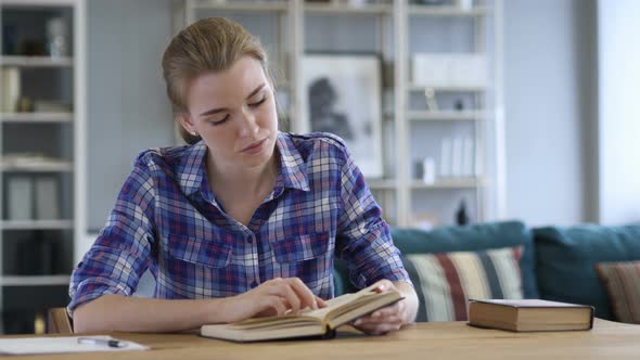 Young Woman Reading Book