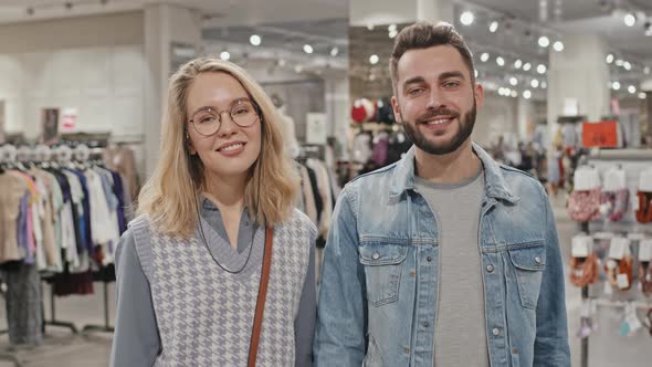 Smiling Young Couple At Clothing Store