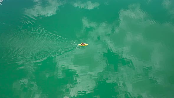 Sportsman Canoeing On The Lake Aerial View