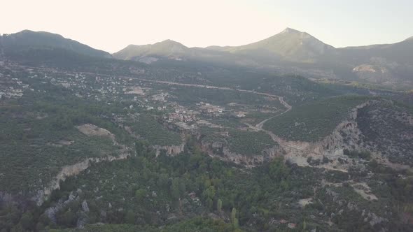 Slow moving aerial clip taken by drone of small village in Geyikbayiri in Turkey amidst the rocky mo