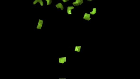 Super Slow Motion Sliced Celery Falls Into the Water with Splashes